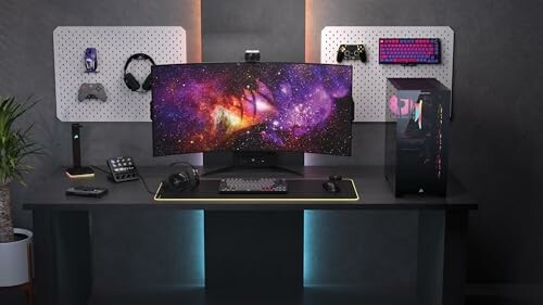 Modern gaming setup with dual monitors and accessories on a desk.