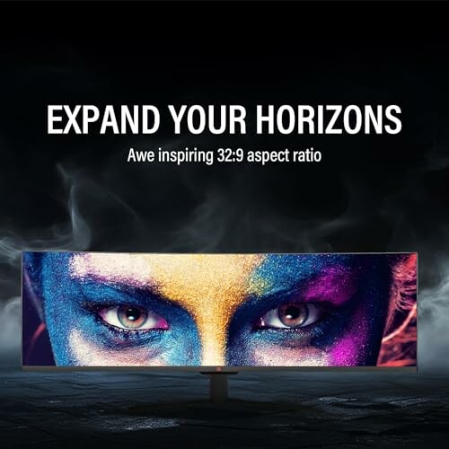 Ultrawide monitor with colorful face art and text 'Expand Your Horizons, Awe inspiring 32:9 aspect ratio'.